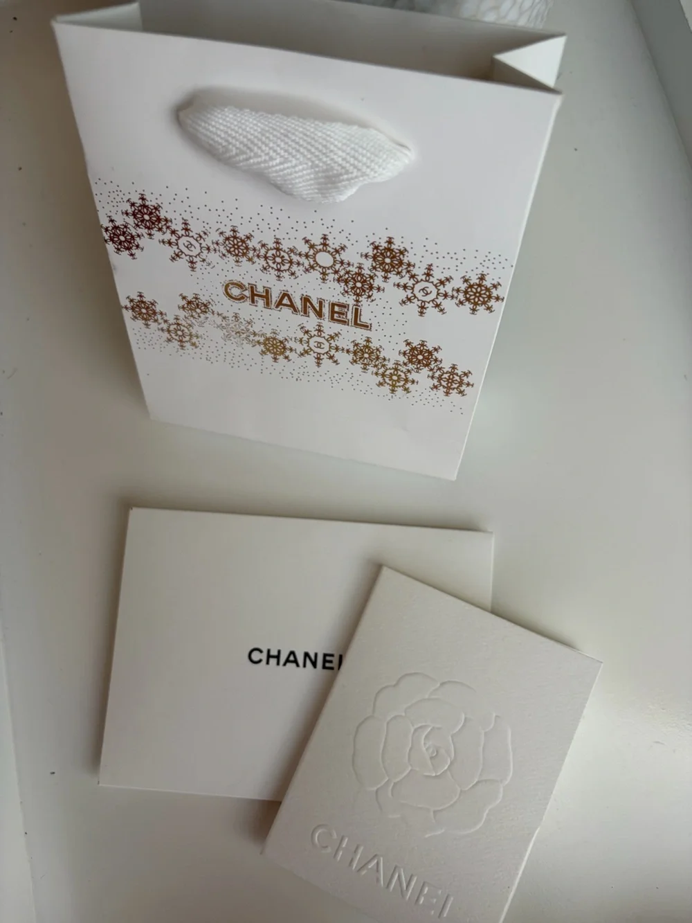CHANEL White and Gold Snowflake Holiday Gift Bag